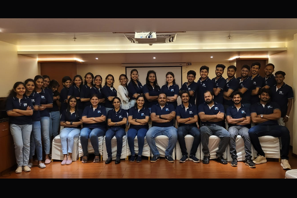 A1 Logics staff gathered for a company meeting